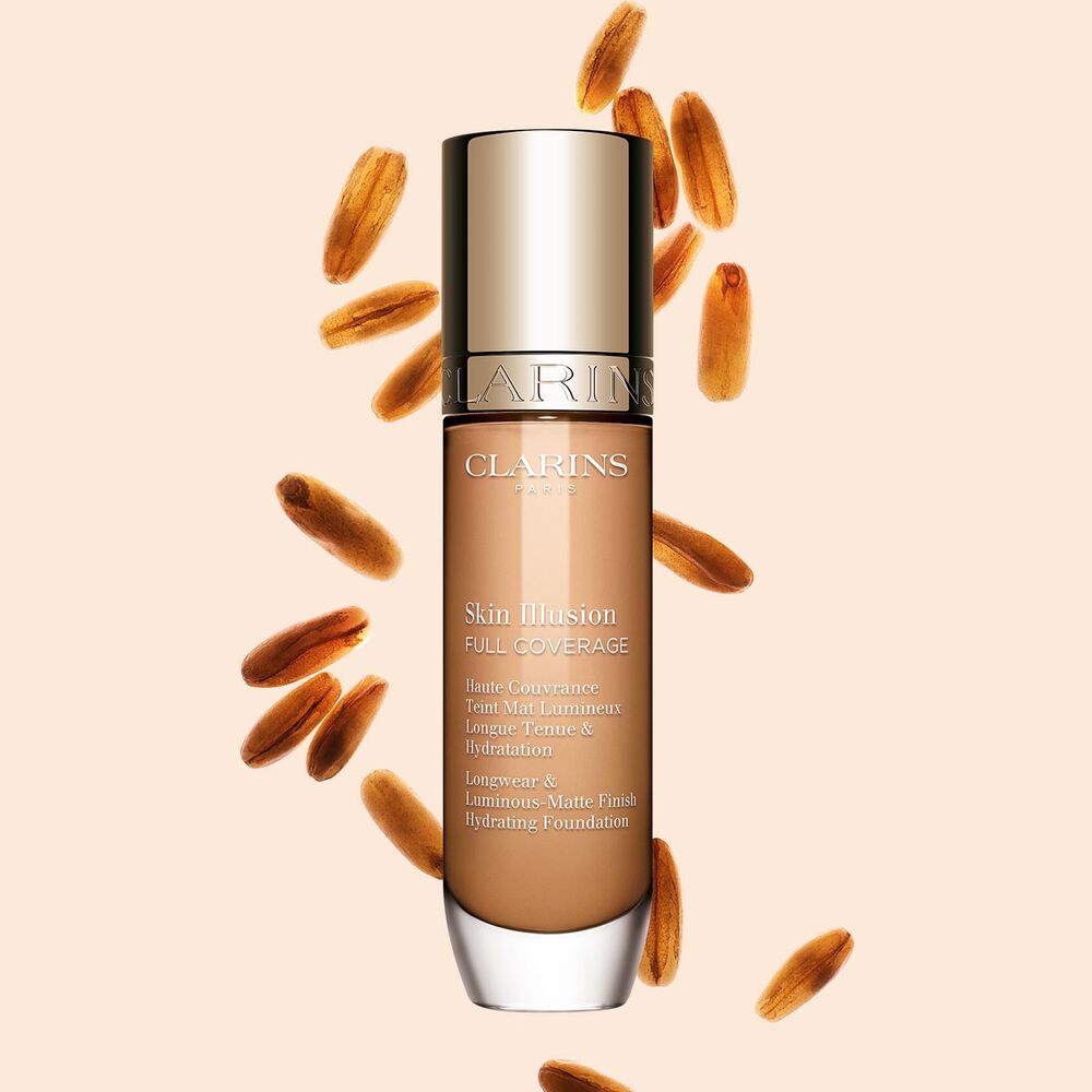 Clarins Skin Illusion Full Coverage showcasing its sleek design and vibrant packaging, the ideal foundation for a flawless & natural complexion.
