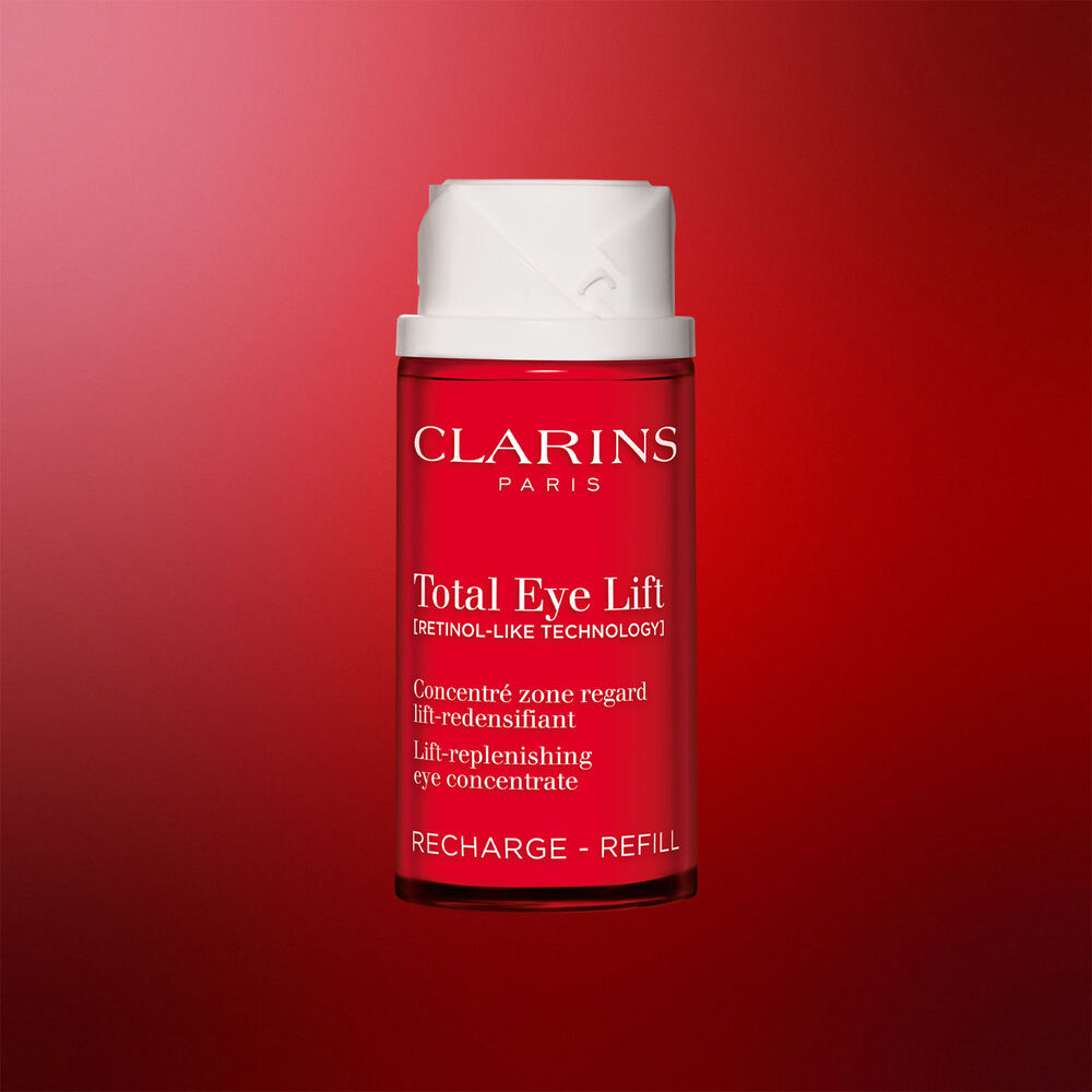 Packshot of Clarins Total Eye Lift anti-aging eye cream refill packaging on a dark red background, highlighting its sustainable refillable design