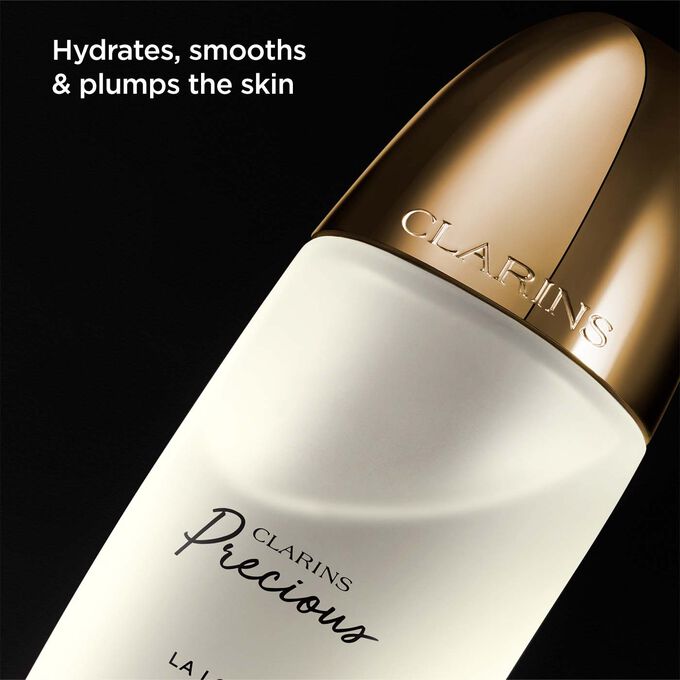 Packshot of Clarins Precious Treatment Essence, with text emphasising its power to hydrate, smooth and plump skin.