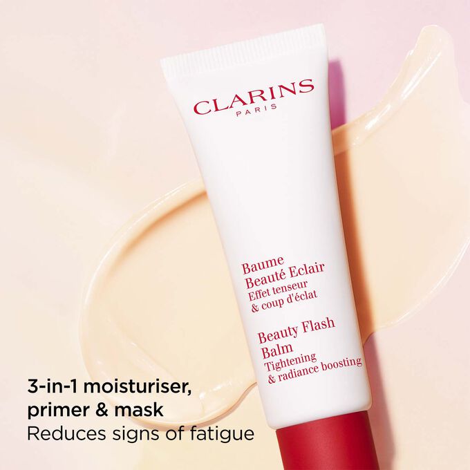 Packshot of Clarins Beauty Flash Balm on a textured background, highlighting its nourishing power for tired skin.