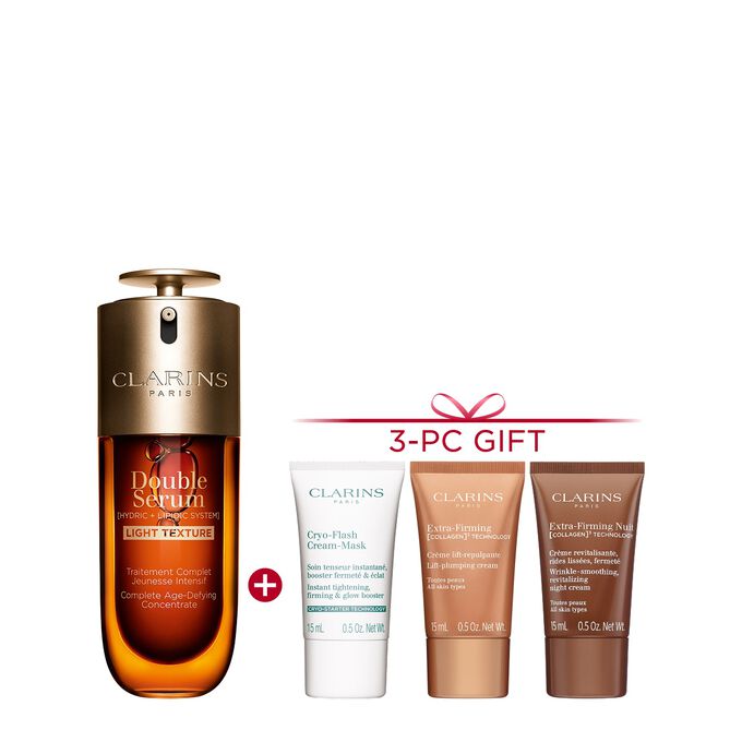 A 50ml bottle of Clarins Double Serum Light Texture among turmeric and provençal reed leaves against an orange background.