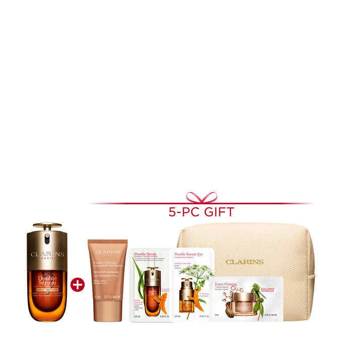 A 50ml bottle of Clarins Double Serum Light Texture among turmeric and provençal reed leaves against an orange background.